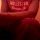 A girl wearing a Hollister shirt records herself taking a shit while sitting on a toilet. Video is rather brief, but sounds are quite audible.
